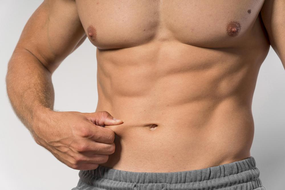 https://fitathome.com/wp-content/uploads/2023/10/front-view-fit-shirtless-man-showing-abs.jpg